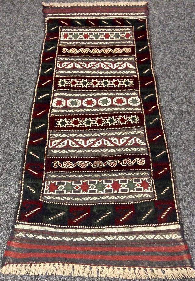 Oriental Rug Shop Purveyors of Fine Rugs & Carpets.